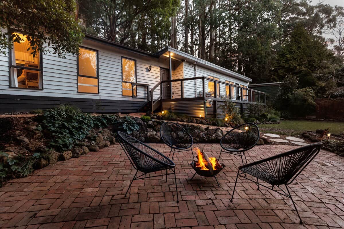 Plenty of entertaining spaces with a large deck and outdoor fire pit, surrounded by Mountain Ash Trees.