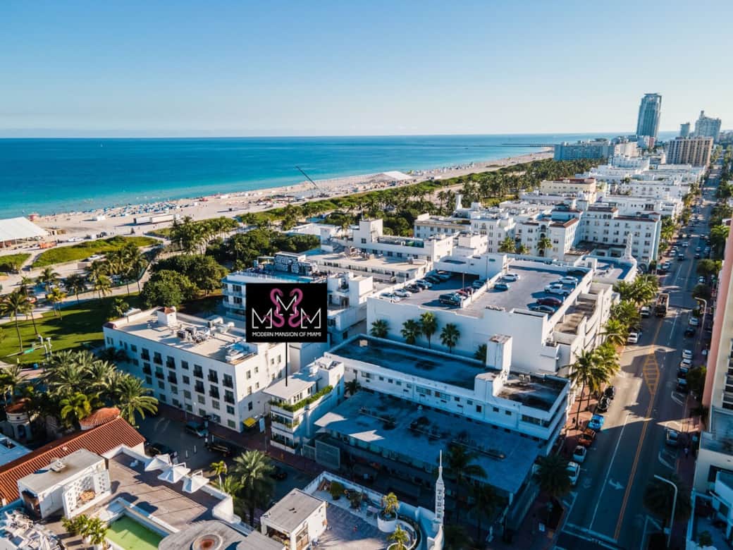EXTERIOR: MODERN MANSION OF MIAMI. Property seen from 11th street. The stop light in left background is the intersection of 11th and Ocean Drive. 