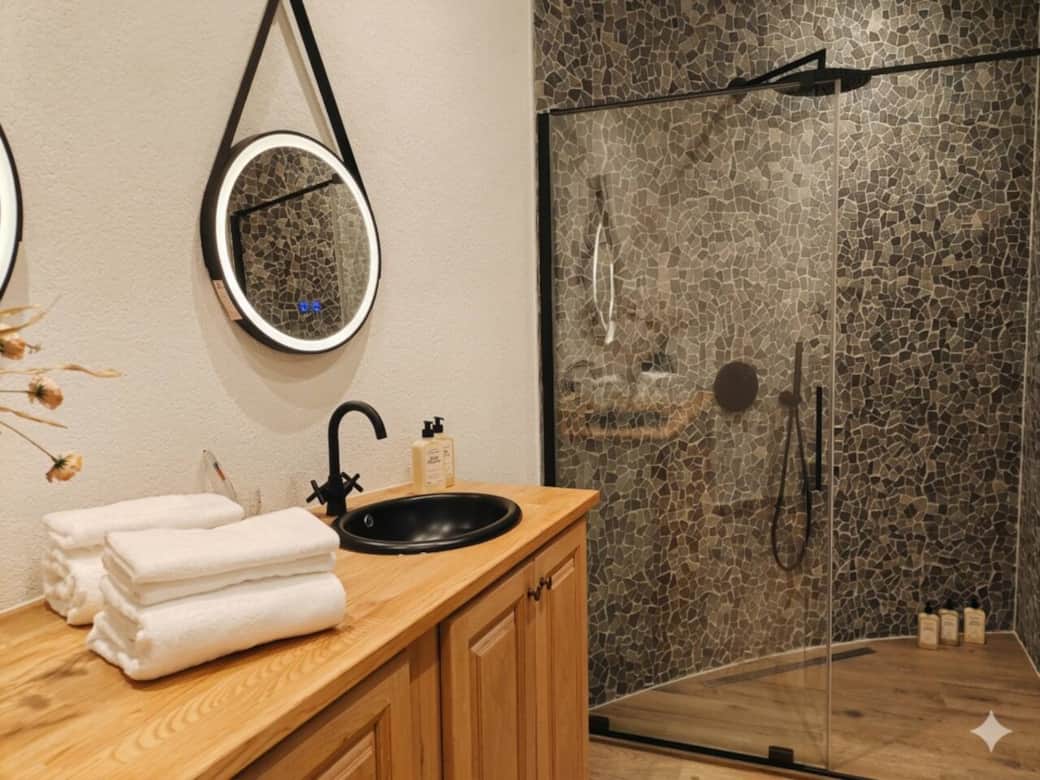 Spacious walk in shower with L'Occitane toiletries