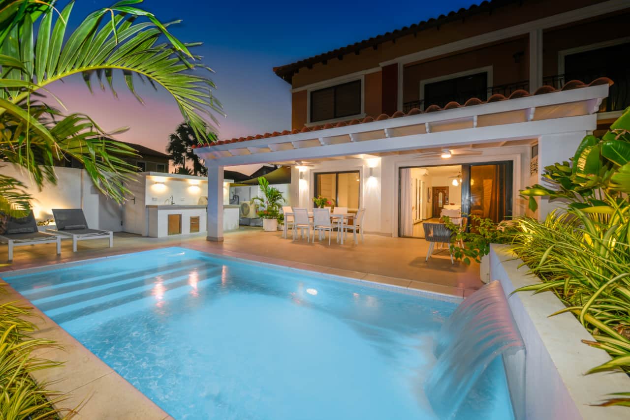 Private backard with pool, BBQ, dining table, and lounging areas