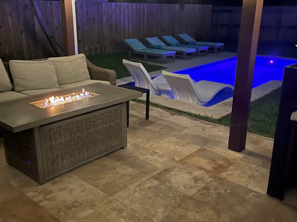 Fire pit over looking Pool/Outdoor Living Space at night