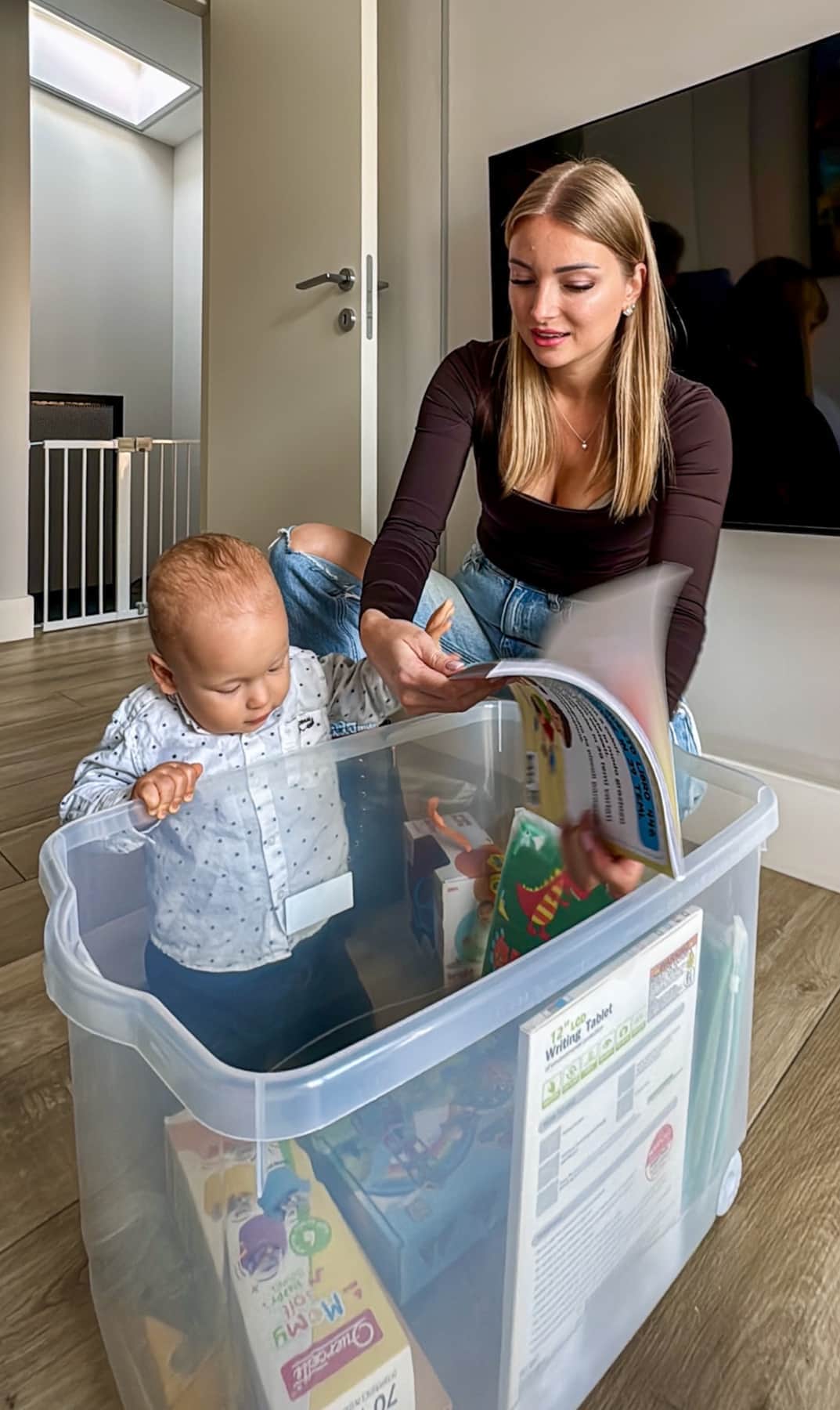 Baby exploring sanitized toys box — RENTAL12 welcome kit Olbia