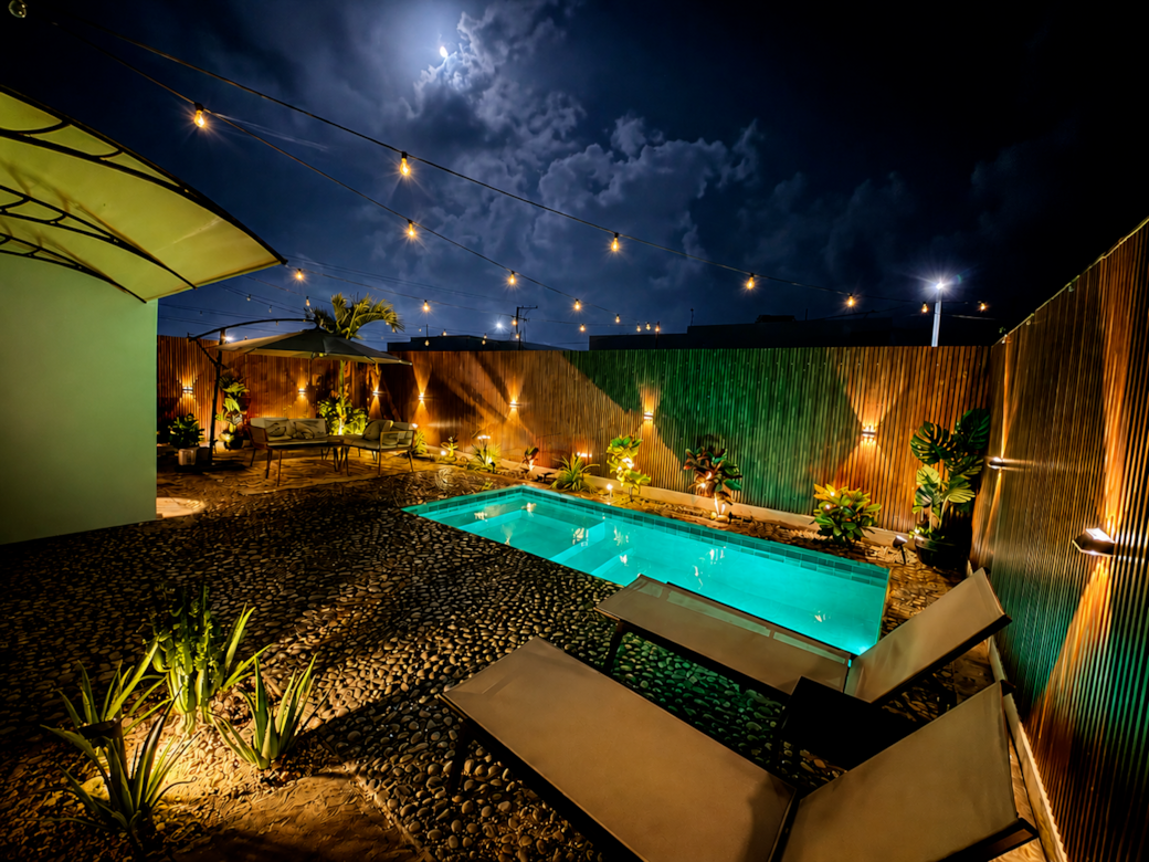 Moonlit oasis with a private pool, tropical ambiance, and cozy outdoor retreat under the stars. Moonlit oasis with a private pool, tropical ambiance, and cozy outdoor retreat under the stars.