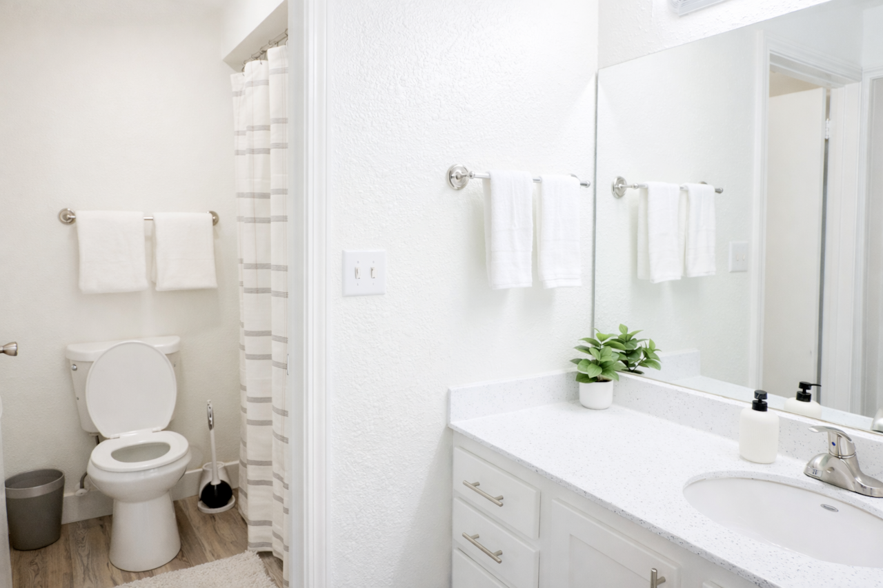 Clean, bright bathroom stocked with essentials for a comfortable stay