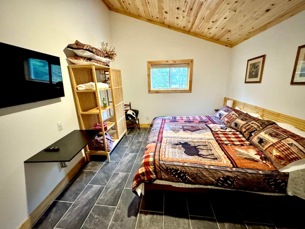 Master bedroom in a king bed configuration, includes TV