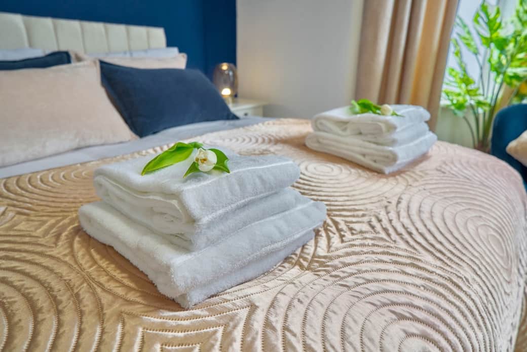 Fresh towels and cosy bedding prepared for a comfortable and relaxing stay.