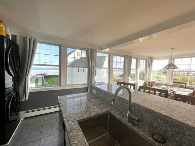 Lots of windows around fully equipped kitchen