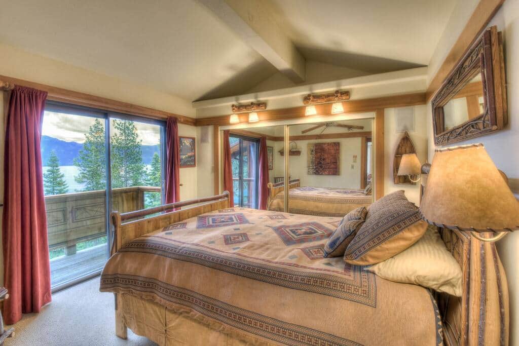 Bedroom 1 with queen bed overlooking Lake