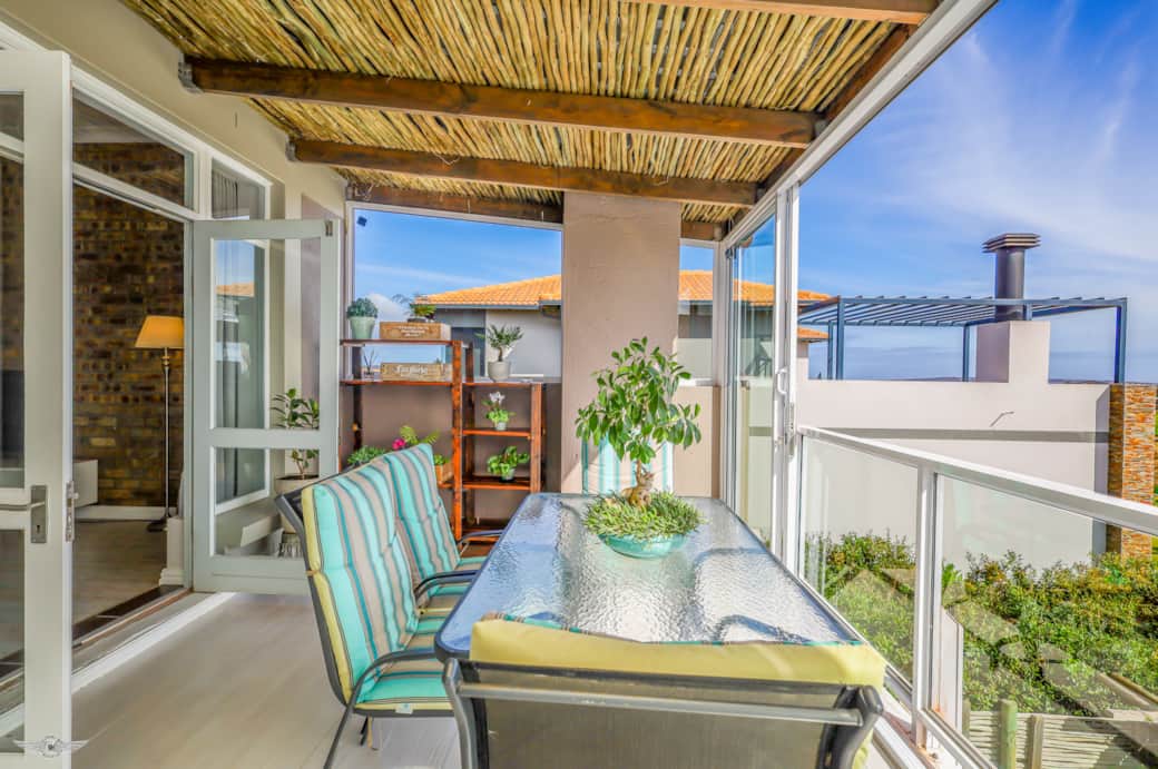 Enclosed Balcony with Patio Dining Table