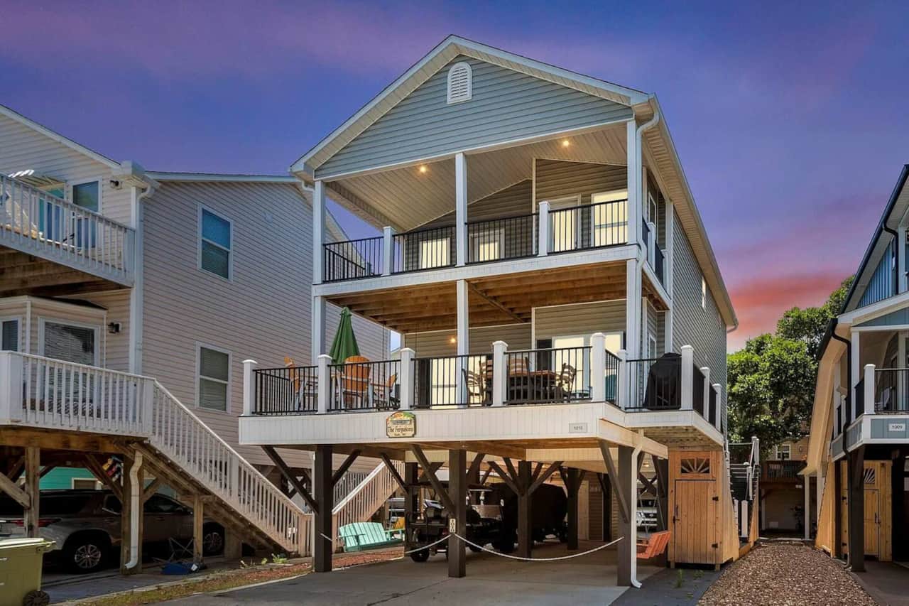 Seas The Day — your elevated 3-story beach house, golf cart included, steps from the Atlantic