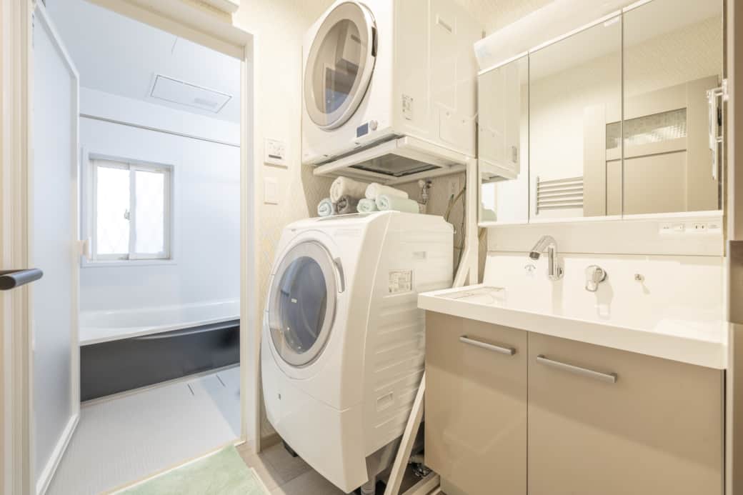 Bathroom laundry stacked washer dryer