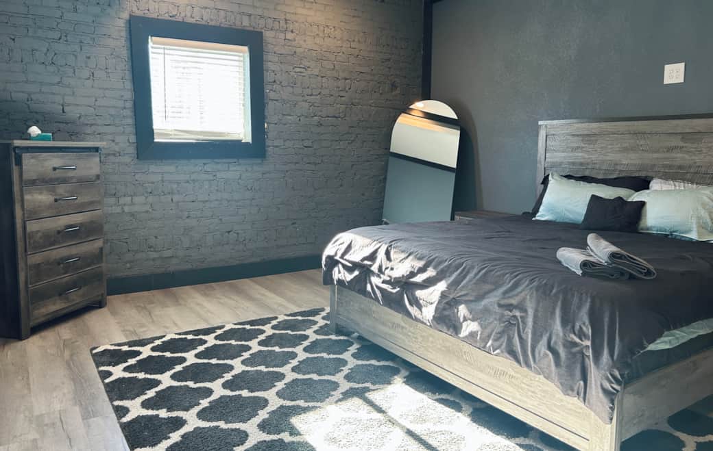 King size bed, full length mirror and dresser in each bedroom