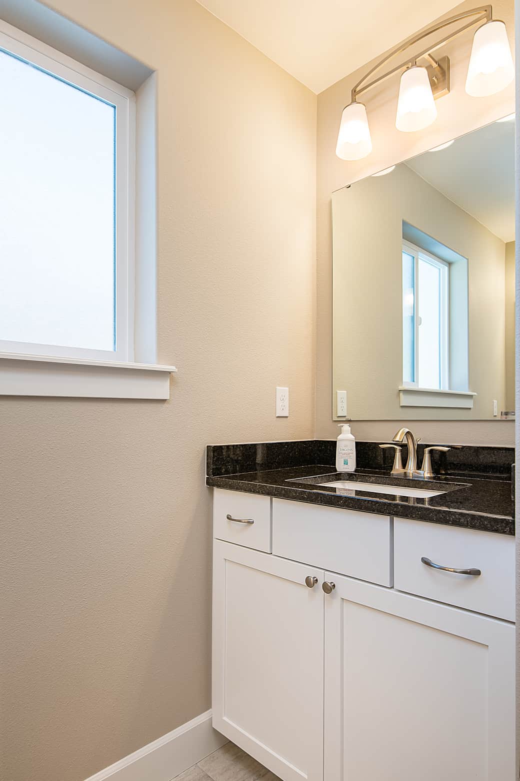 bathroom with dual sinks