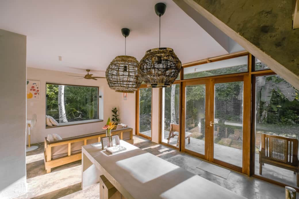 Open plan living room and dining area overlooking private patio and garden