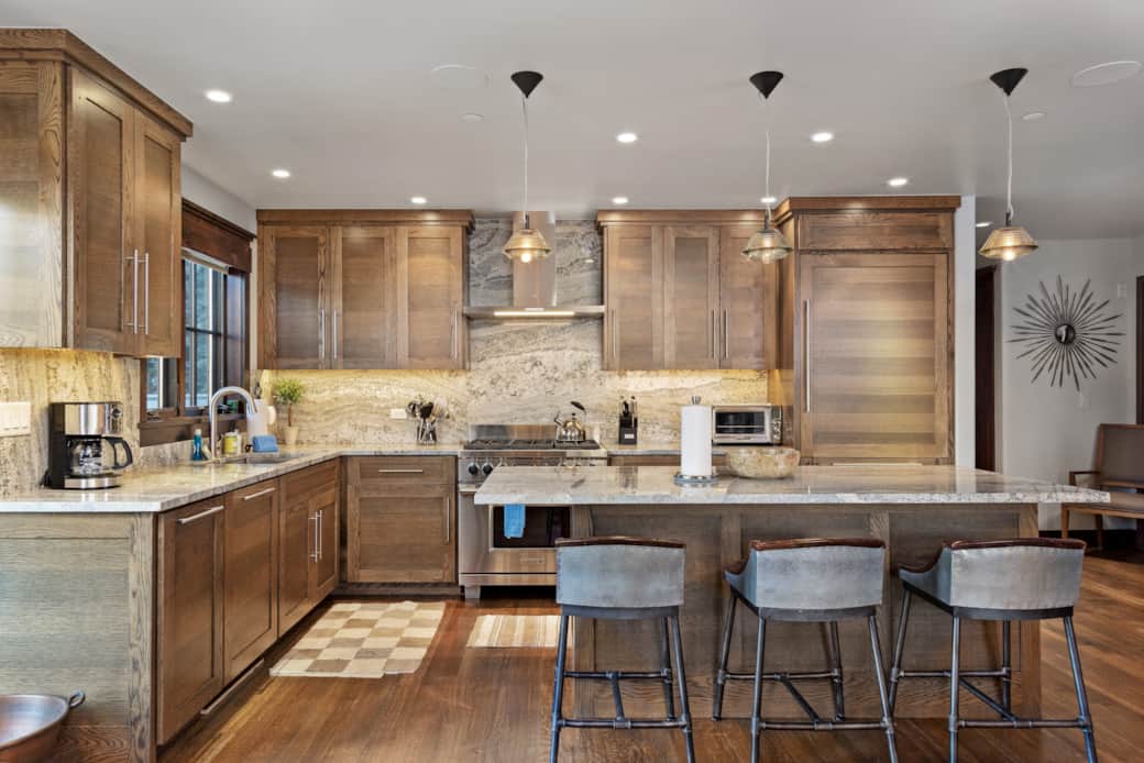 Large, stocked kitchen with plenty of seating and open concept layout