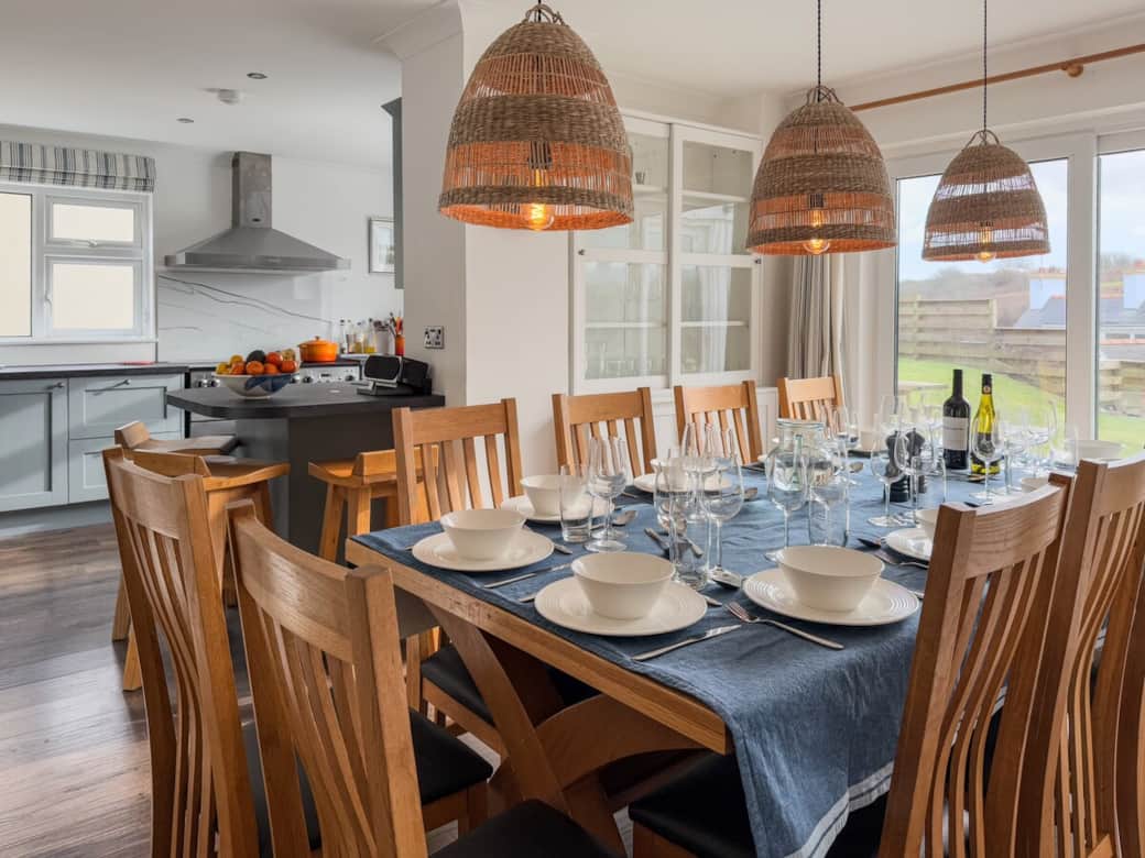 A look from the dining room to the kitchen.A generous space designed for shared meals & celebrations A look from the dining room to the kitchen.A generous space designed for shared meals & celebrations