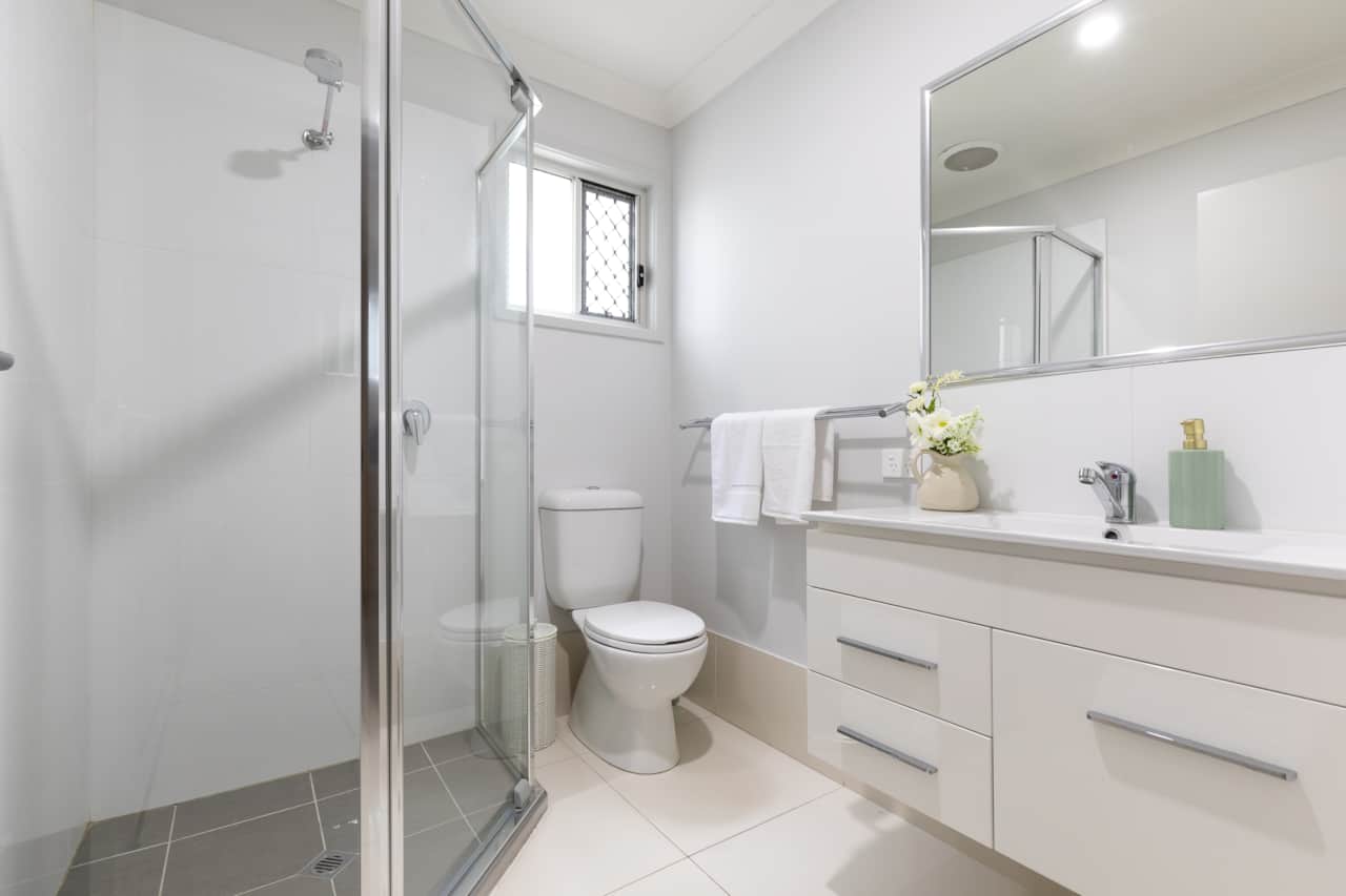 Bathroom: Stylish bathroom with walk-in shower, vanity, and clean finishes 