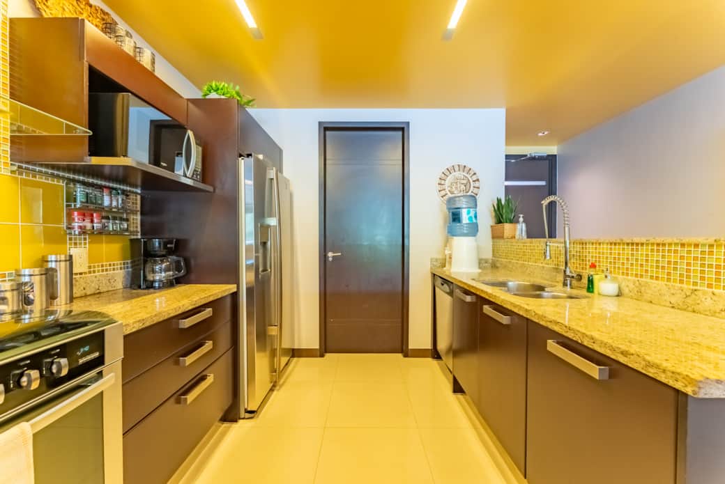 Washer and dryer located in a separate laundry room off the kitchen, a must-have for longer stays