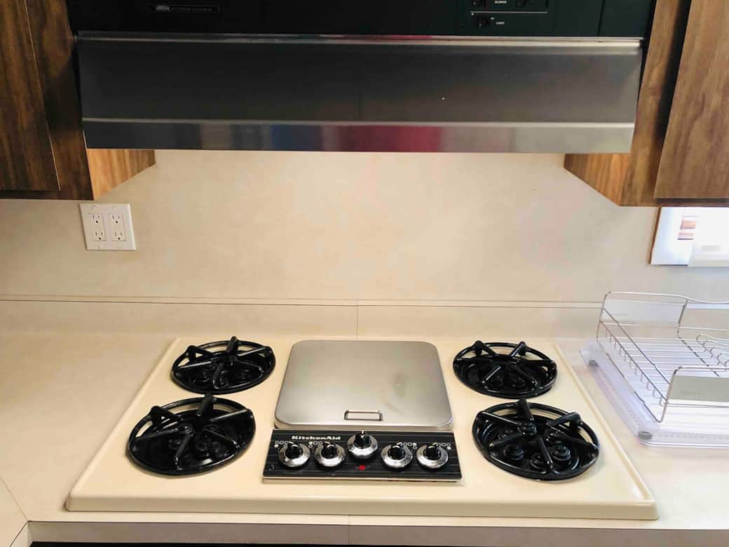 Gas cooktop with exhaust range. Gas cooktop with exhaust range.