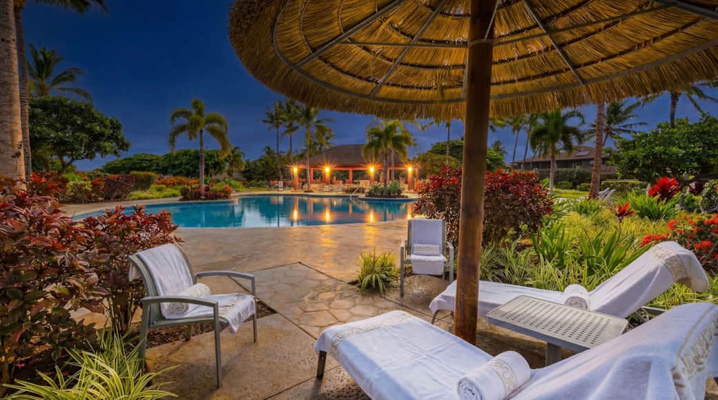 Large Ohana pool with cabanas and loungers, steps away from The 404