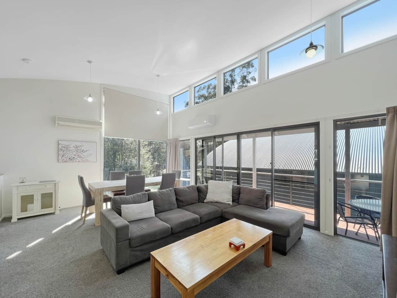 Welcome to our inviting living room! Relax in a bright, spacious setting with ample natural light.