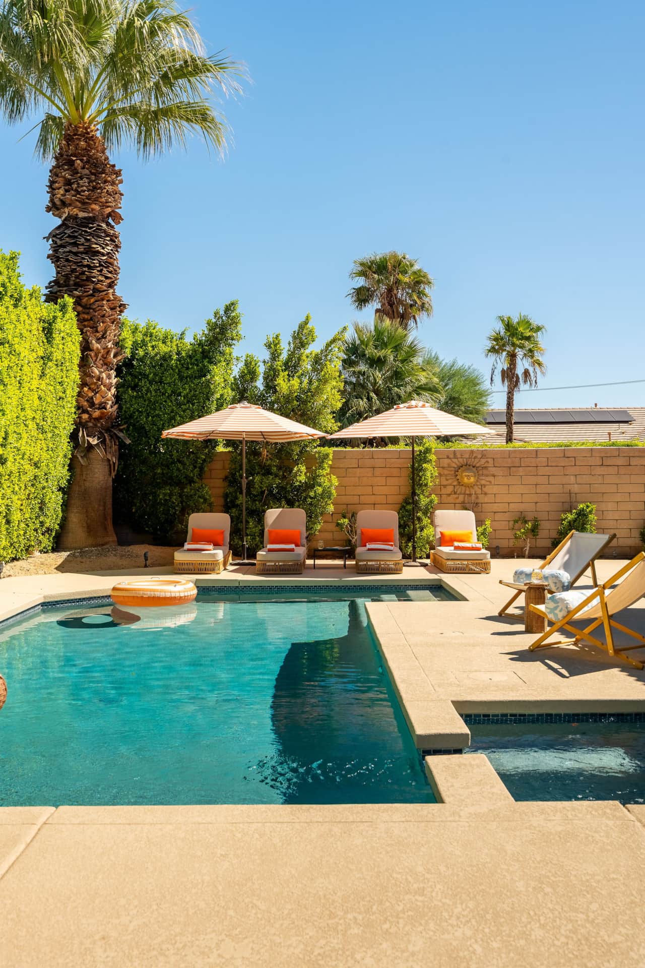 Pool deck w/ loungers and sling chairs