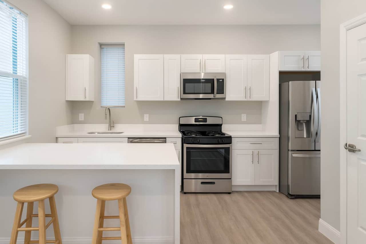 Big kitchen with breakfast bar.
Dishwasher , oven range , microwave, 33 inch refrigerator. 
Connected to a big living room and powder room on the same floor.