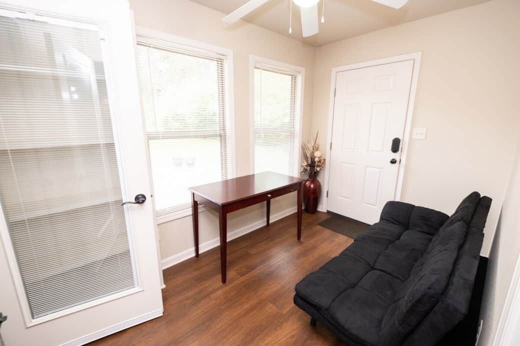 Office with comfortable Futon with Memory Foam mattress and adjustable headrest provide sitting or sleeping space. Behind the door is floor to ceiling built-in bookcase. Office with comfortable Futon with Memory Foam mattress and adjustable headrest provide sitting or sleeping space. Behind the door is floor to ceiling built-in bookcase.