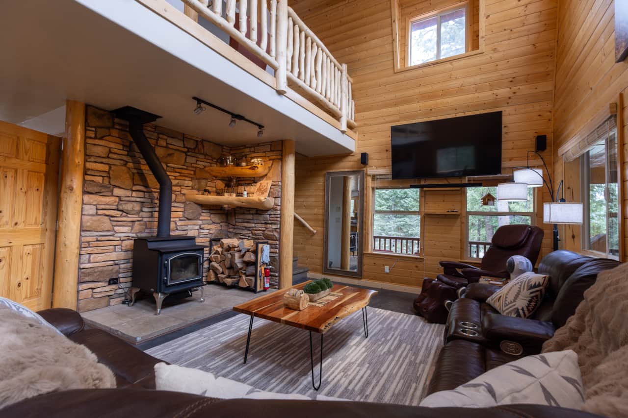 Vaulted Great Room • 75” TV & Real Log Fireplace