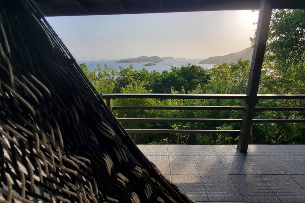 Rest on the hammock and take in island and mountain views.