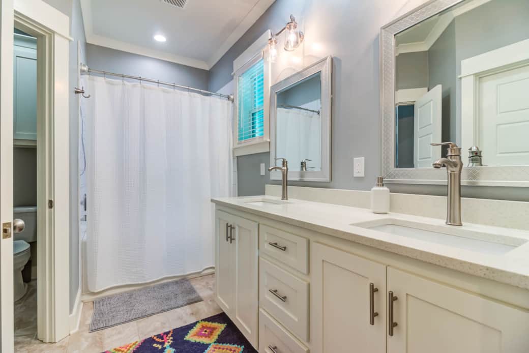 Bright, modern bathroom with fresh towels and charm. Also great walking closet