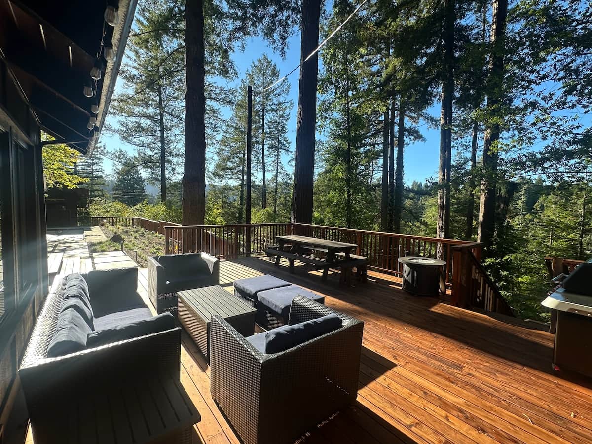 The home is situated on a large lot surrounded by redwood and Douglas fir trees with open valley views. 