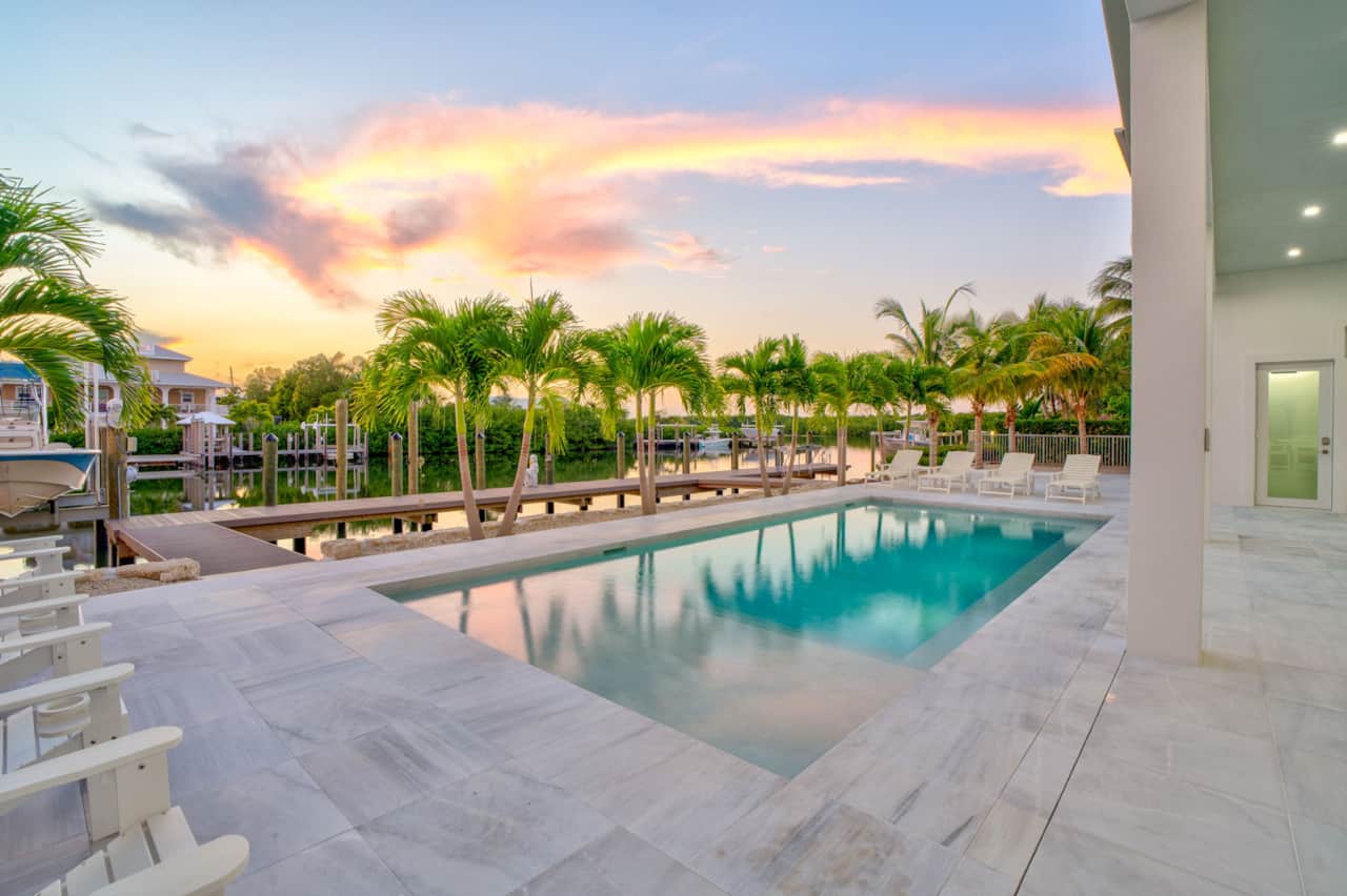 Sunset view of the pool and dock