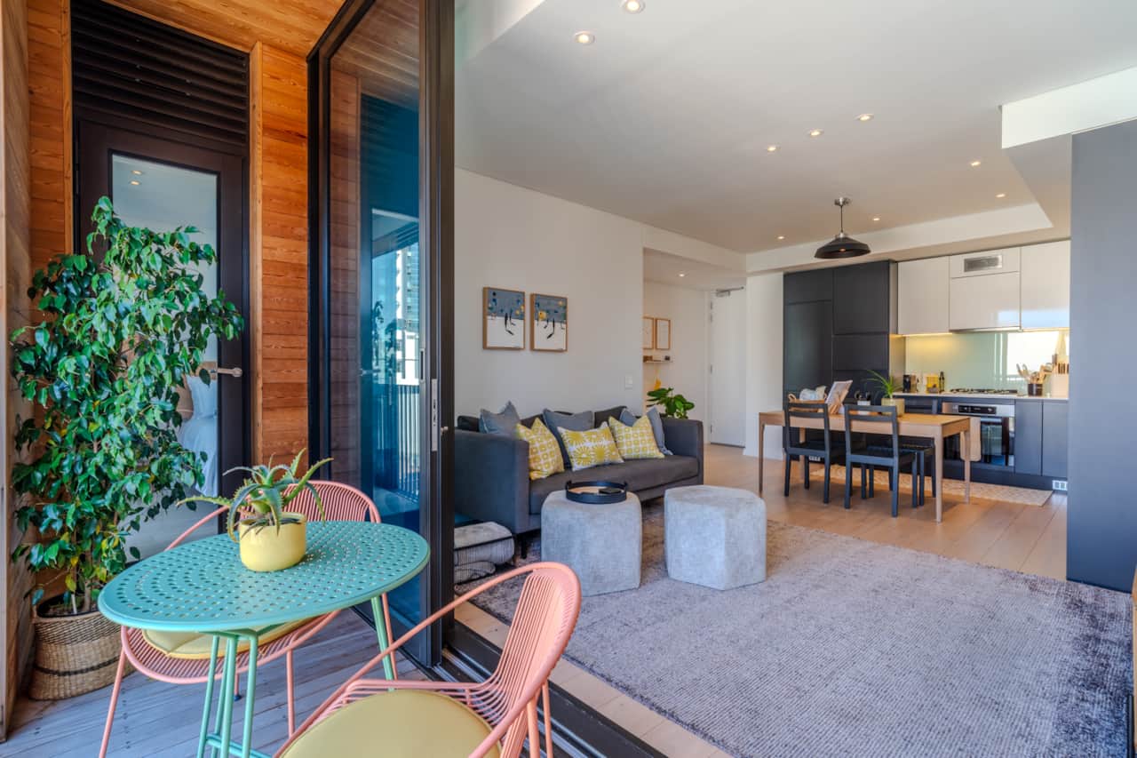 Large double glazing sliding doors open up to enjoy the city energy
