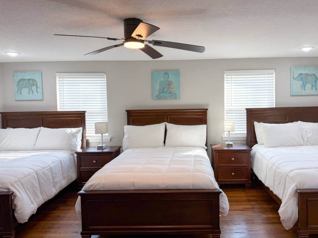 Mia Room - This spacious bedroom features 3 full-size beds, a walk-in closet, and a smart TV.