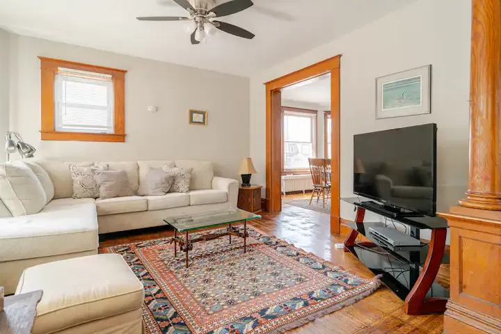Living Room: Bright and inviting space with vintage charm, perfect for unwinding after adventures! Living Room: Bright and inviting space with vintage charm, perfect for unwinding after adventures!