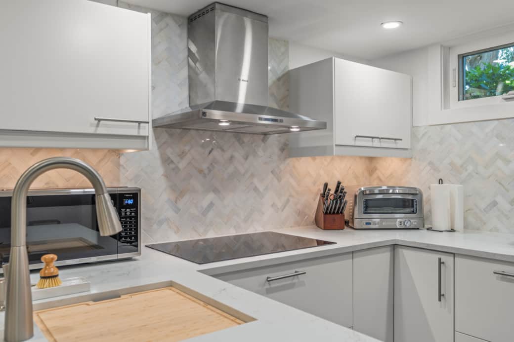 Panasonic microwave, Bosch hood range, Bosch induction cooktop, Cuisinart pizza oven and air fryer