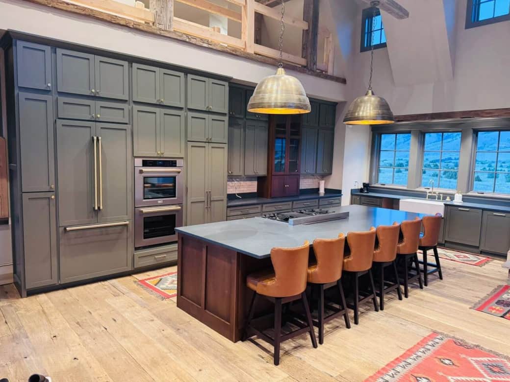 Kitchen featuring double oven and walk thru pantry with washer/dryer