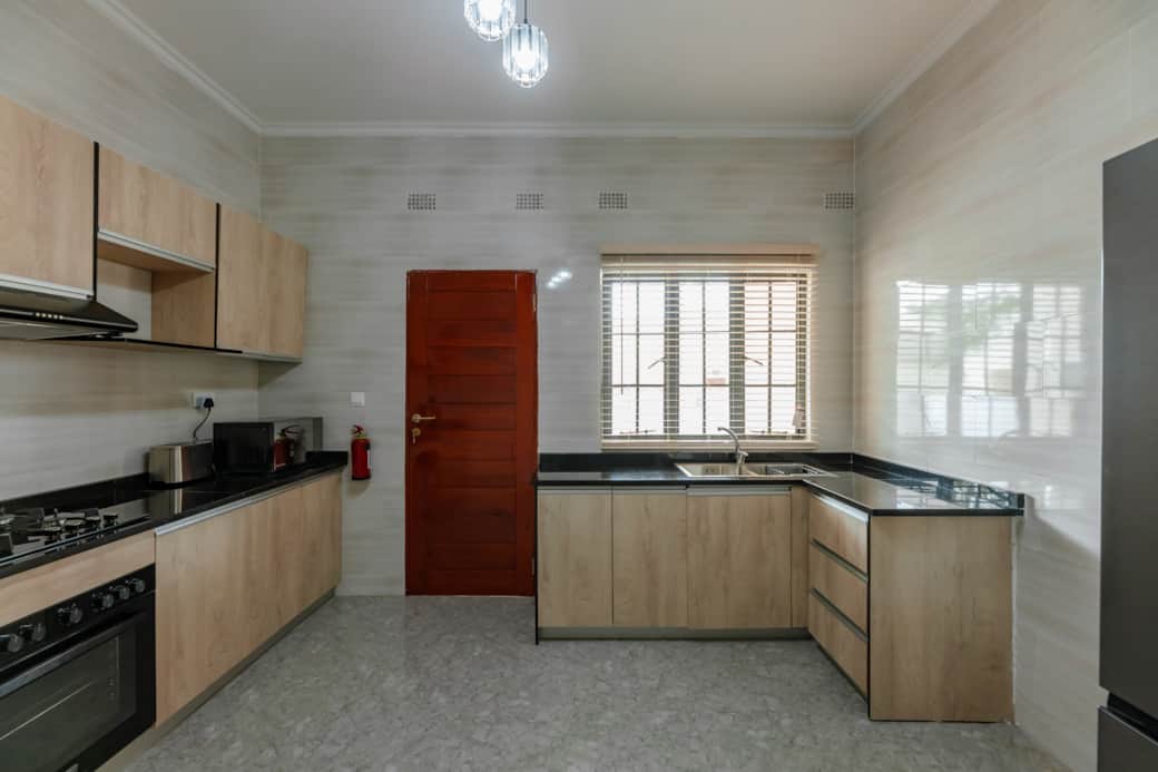 Fully equipped kitchen with oven stove and ample counter space