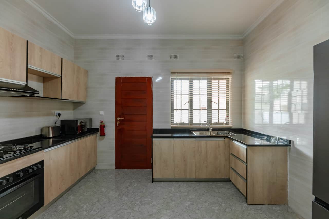 Fully equipped kitchen with oven stove and ample counter space