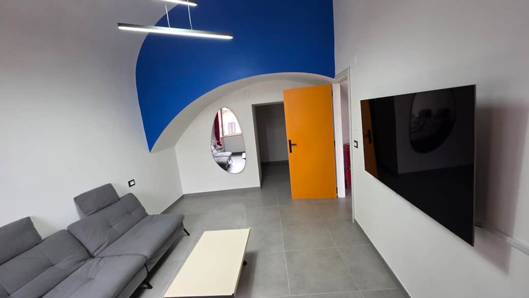 Minimalist living room overview at Agli Archi Eco House in Chieti