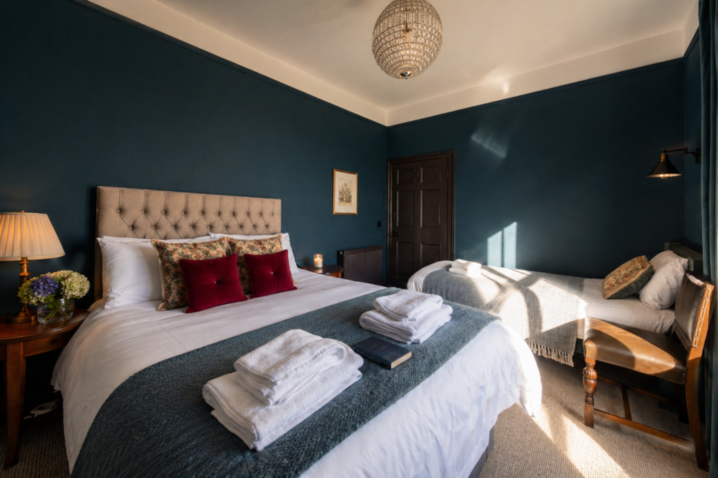 Rich blue room for a Dodo-inspired Caucus Race! Luxurious bed and mascot guarantee a fun, restful st
