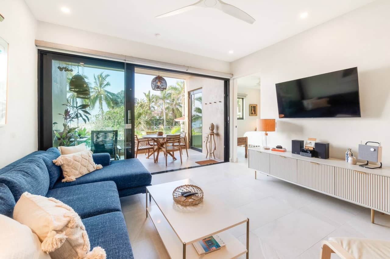 The living area features a Smart tv, Blu-ray player & a beautiful Marshall Bluetooth speaker