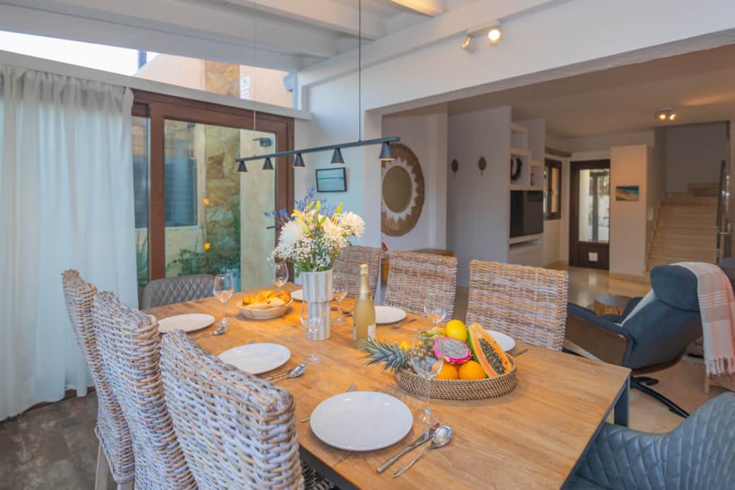 Dining area for 8 people, adjoining the living room of your holiday villa