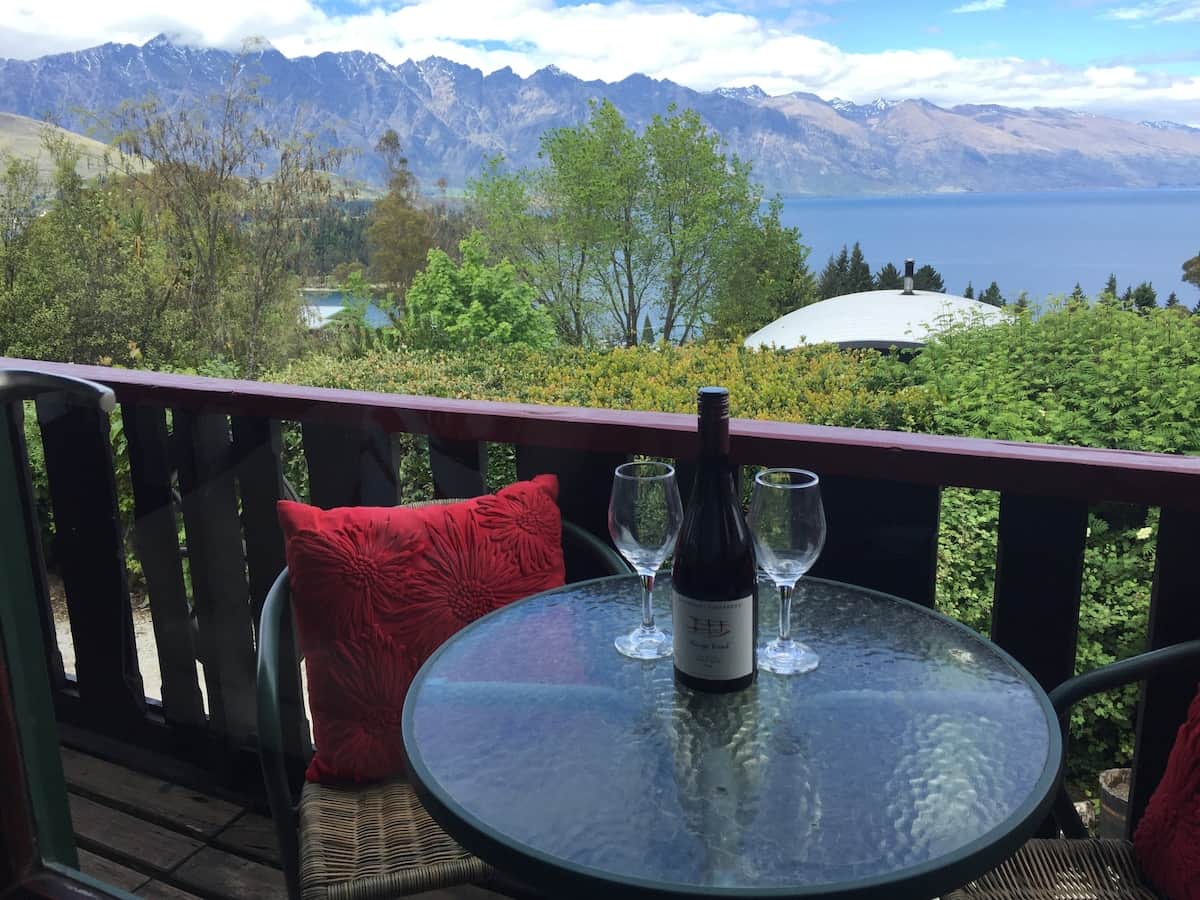 Private deck with garden and mountain views at Walk to Town 41A Alpine Chalet Queenstown