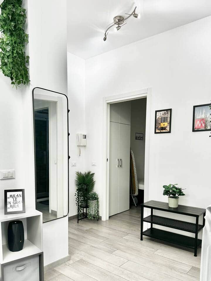 An open space entrance connected with the living room and kitchen. Sofa bed in this area.