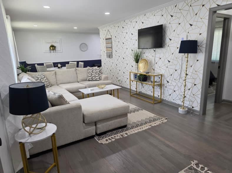 Your family will find comfort in this spacious living area with plenty of seating