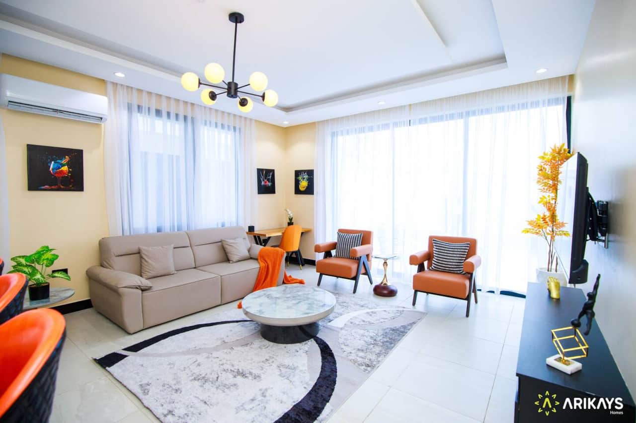 SPACIOUS LIVING ROOM  with a sofa, chairs
and large windows. We have recently added blackout curtains!