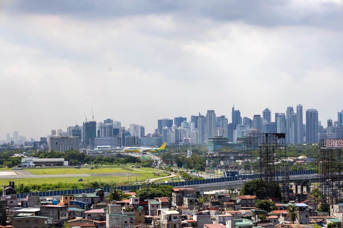 Aircraft approaching NAIA runway area, view from the Raya P09 balcony (plane spotting setup)
