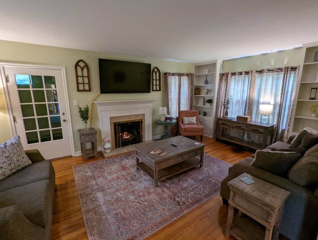 The living room is cozy with a feeling of Home. Enjoy the gas burning fireplace during the cold months, relax on the soft couch or loveseat and watch your high definition 65" Smart TV. The living room is cozy with a feeling of Home. Enjoy the gas burning fireplace during the cold months, relax on the soft couch or loveseat and watch your high definition 65" Smart TV.